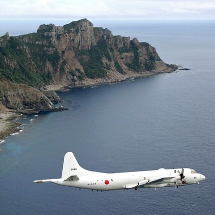 A Japanese surveillance drone flies over the disputed islands known as the Senkakus in Japan and the Diaoyus in China. Photo: AP