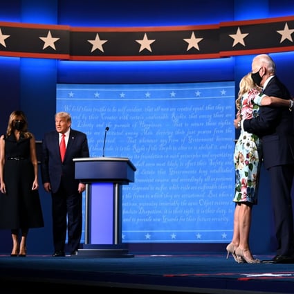US First Lady Melania Trump stands with US President Donald Trump, as Jill Biden hugs husband and Democratic presidential candidate Joe Biden at the end of the final presidential debate in Nashville, Tennessee, on October 22. Photo: AFP