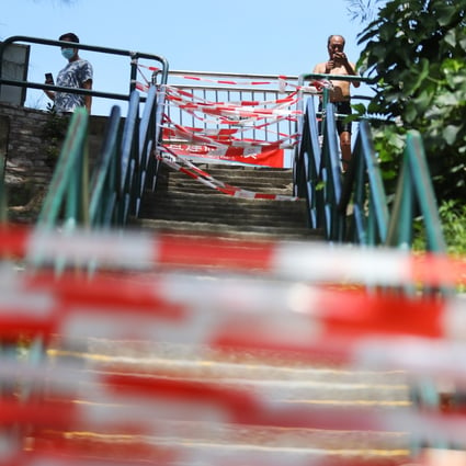 Stairs to the beach cordoned off at Clear Water Bay in July. All gazetted beaches in Hong Kong will reopen on November 3, but barbecue sites within them will remain closed. Photo: Dickson Lee