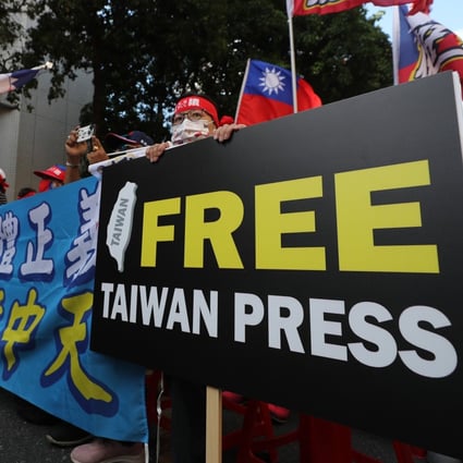 People demonstrate outside the National Communications Commission in Taipei as it holds a public hearing on Monday. Critics say taking CTi News off the air will erode freedom of the press in Taiwan. Photo: CNA