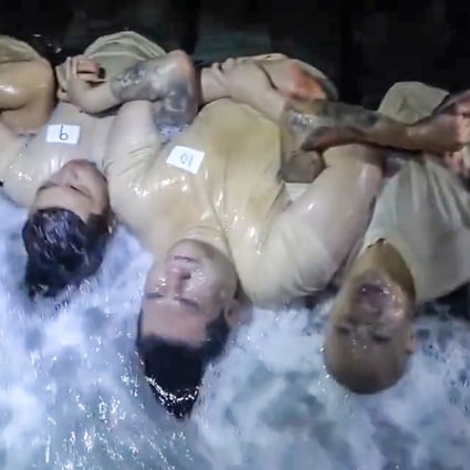 Contestants lying down and facing icy waves at midnight hours during season two's premiere. Photo: Handout