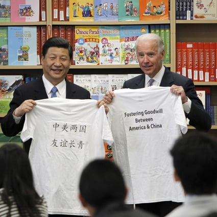 President Xi Jinping and then-US vice-president Joe Biden hold T-shirts given to them by students during their visit to the International Studies Learning Centre in South Gate, California, on February 17, 2012. Improving the bilateral relationship is essential to ensuring prosperity for both countries and the wider world. Photo: AP
