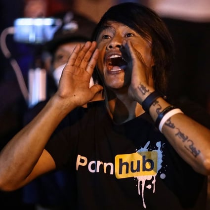 A pro-democracy protester shouts during a demonstration at the Ministry of Digital Economy and Society in Bangkok after the ministry blocked the Pornhub website. Photo: AFP