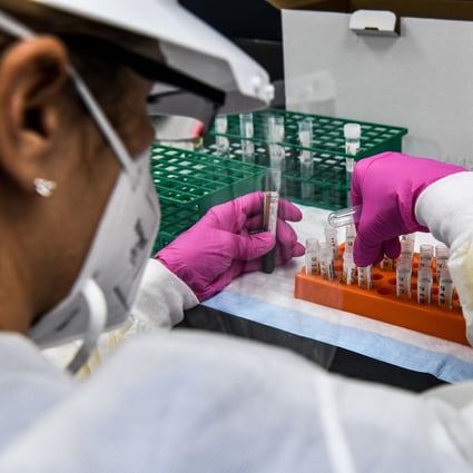 A technician sorts blood samples inside a lab for a Covid-19 vaccine study at the Research Centers of America in Hollywood, Florida, on August 13. Photo: AFP/Getty Images/TNS