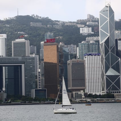 A sailboat makes its way through Victoria Harbour, with Admiralty on Hong Kong Island in the background, as seen from the Tsim Sha Tsui promenade on September 6. Photo: Dickson Lee