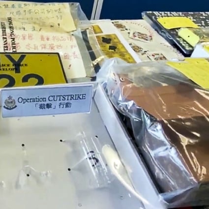 Police display evidence collected during the anti-triad operation in northern Hong Kong. Photo: Facebook