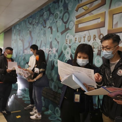 Potential homebuyers line up at a sales office in Tsim Sha Tsui, for CK Asset’s 98 units at El Futuro in Sha Tin. The frenzy in the property market stands in sharp contrast to Hong Kong’s ongoing recession and high unemployment. Photo: Xiaomei Chen