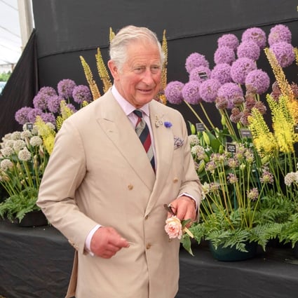 Britain's Prince Charles favours double-breasted suits, ties and matching handkerchiefs, and tells Vogue magazine: “People come round after 25 years to dressing like I do.” Photo: Arthur Edwards/Pool via Reuters