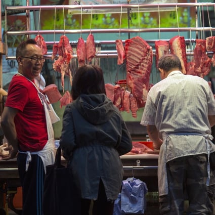 Patrons buy meat from a butcher’s stall in Hong Kong, where the per capita meat consumption rate is among the highest in the world. Photo: EPA