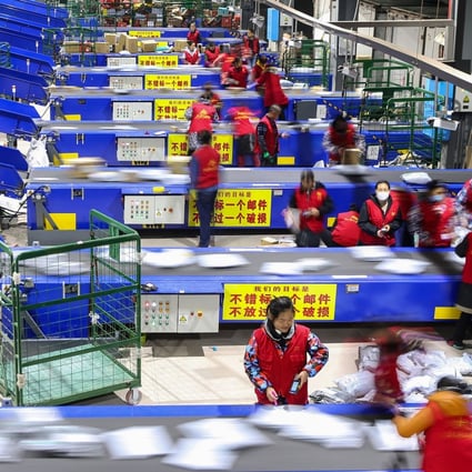 Workers sort packages after the Singles’ Day shopping festival at a delivery company in Hengyang, in China’s central Hunan province, on November 12, 2018. Photo: AFP