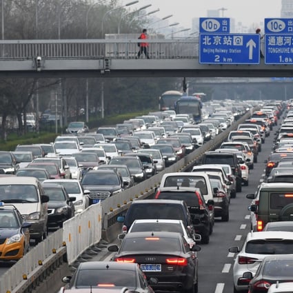 Cars crowd the second ring road in Beijing, as traffic gets back to normal after a two-month coronavirus-induced lockdown, on March 24. China is the world’s largest carbon emitter, with Japan at fifth and South Korea at seventh place. Photo: AFP