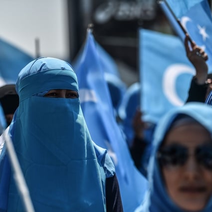 Demonstrators wave the flag of East Turkestan during a protest in 2018 against China’s treatment of ethnic Uygur Muslims in Xinjiang. Photo: AFP