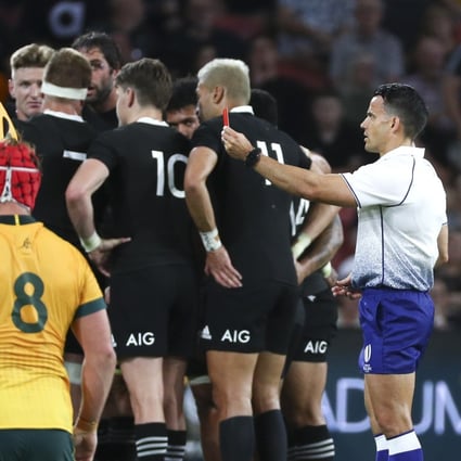 Referee Nic Berry shows a red card to Australia’s Lachie Swinton. Photo: AP