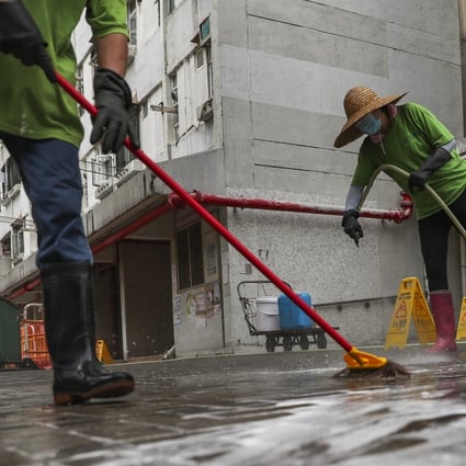 Cleaners wash the grounds of Yau Oi Estate in Tuen Mun after rats were found with Hepatitis E in 2019. Photo: Sam Tsang