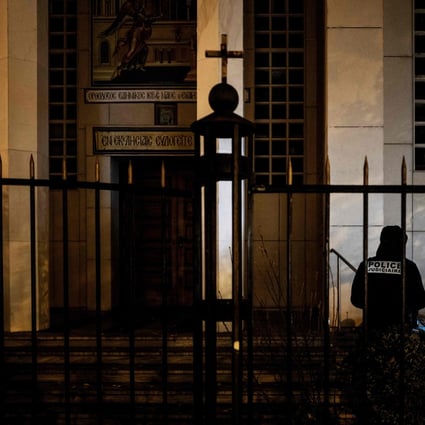 Police officers examine the entrance of the Orthodox Church in Lyon, France, where an attacker armed with a sawn-off shotgun wounded an Orthodox priest on October 31. Photo: AFP