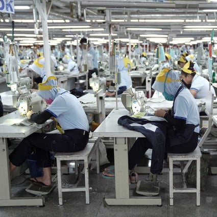 Workers operate sewing machines at a factory in Central Java that makes apparel – one of the sectors Indonesia plans to prioritise under the potential new trade deal with the US. Photo: Bloomberg