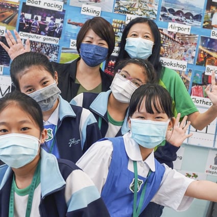 (Back row left to right) Cheung Lai-wan, principal of Shamshuipo Kaifong Welfare Association Primary School and Brianna Hui, chief executive officer, Sowers Action, with school students in Sham Shui Po. Photo: Felix Wong