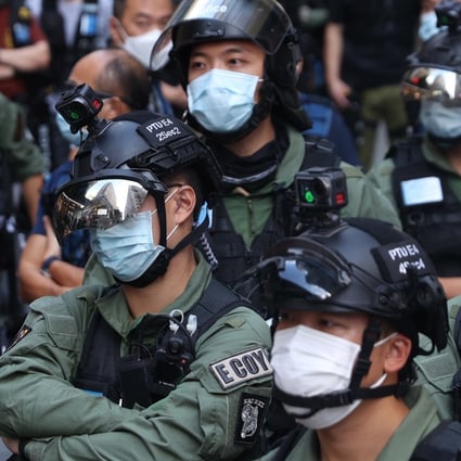 Police officers stand guard during a rally in Hong Kong in October. Photo: EPA-EFE