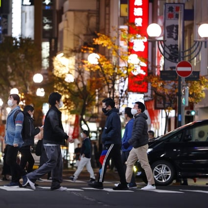 People are seen in the Susukino entertainment district in Sapporo. The Hokkaido government has raised its coronavirus alert and called on restaurants and bars in the district to close at 10pm. Photo: Kyodo