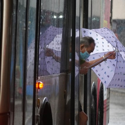 An elderly passenger steps out of a bus into the pouring rain in Tsim Sha Tsui. Hong Kong’s Chief Executive Carrie Lam had announced in January that a scheme allowing people aged above 65 to travel for HK$2 on public transport would be extended to those aged between 60 and 64. Photo: Sam Tsang