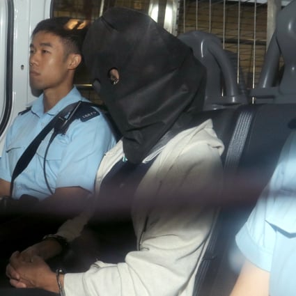 HKU associate professor Cheung Kie-chung (face covered) is accused of murdering his wife Chan Wai-man. Photo: Dickson Lee