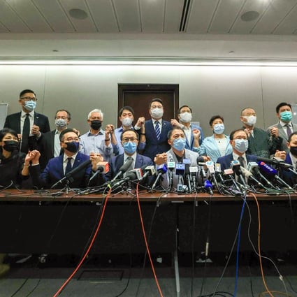 Hong Kong opposition legislators announce their intention to quit the Legislative Council at a press conference at Tamar on Wednesday. Photo: May Tse