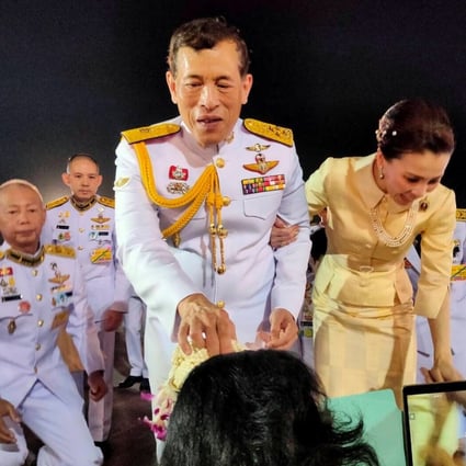 Thailand’s King Maha Vajiralongkorn and Queen Suthida greet royalists at an airport in Udon Thani province. Photo: Reuters