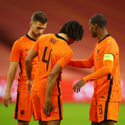 Netherlands’ Nathan Ake reacts after sustaining an injury in a friendly game with Spain. Photo: Reuters