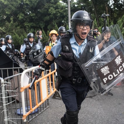 Protesters clash with police in Sheung Shui on July 13, 2019. Officers were among the targets of doxxing, the publishing of personal information on the internet with malicious intent. Photo: Getty Images