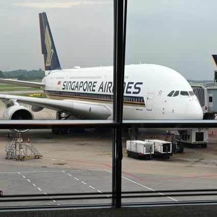 A Singapore Airlines Airbus A380 sits parked on the tarmac at Changi International Airport in Singapore on October 24. From November 22, Singapore and Hong Kong will launch quarantine-free travel between the two places. Photo: AFP