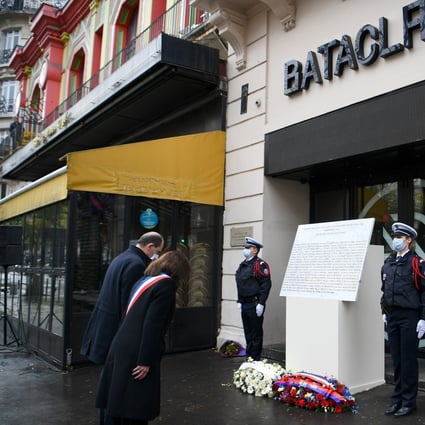 French Prime Minister Jean Castex and Paris Mayor Anne Hidalgo lay a wreath outside the Bataclan concert venue on Friday. Photo: Reuters
