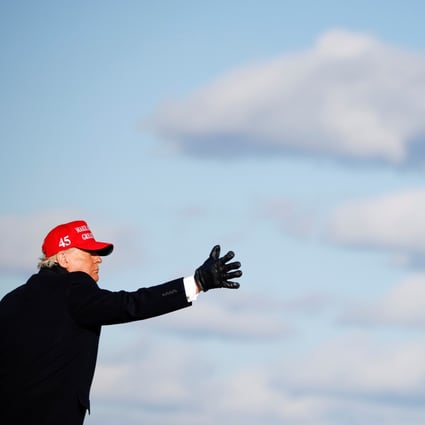 US President Donald Trump tosses a “Make America Great Again” cap during a campaign rally at Wilkes-Barre Scranton International Airport in Avoca, Pennsylvania, on November 2. Would-be autocrats in liberal democracies, like Trump, cannot disseminate nationalist propaganda nearly as efficiently or uniformly as Beijing. Photo: Reuters