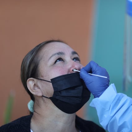 A woman is tested for Covid-19 at a hospital in Los Angeles. California has surpassed 1 million cases, with stricter restrictions imposed to curb the spread of the virus. Photo: Reuters