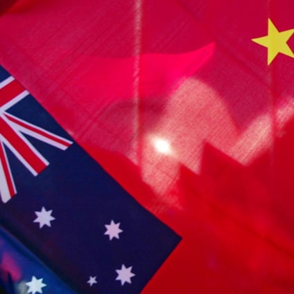 The Sydney Opera House is seen through a Chinese flag. Photo: AFP