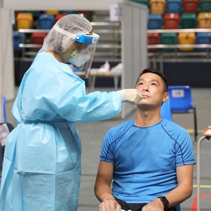 A Hong Kong resident gets a swab taken at a testing station in Wan Chai on September 1, as part of a 14-day universal community testing programme for Covid-19 in the city. Photo: Xinhua