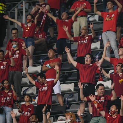 Shanghai SIPG supporters cheer for their team during the sixth round of the Chinese Super League against Beijing Guoan in Suzhou in August. Photo: Xinhua