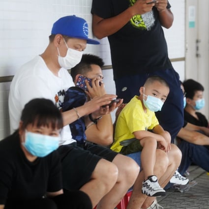 Families queue for Covid-19 tests at Saint Teresa’s Hospital in Mong Kok in July, in the early days of the third wave in Hong Kong. Photo: Winson Wong