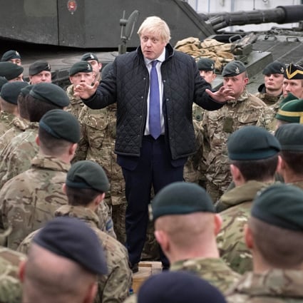 Britain's Prime Minister Boris Johnson speaks with troops. File photo: AFP