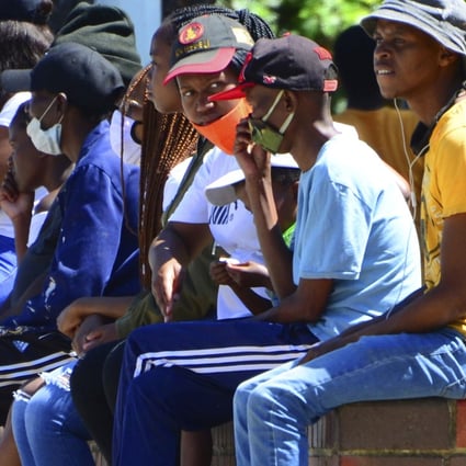 South Africans queue for social grant payments at a post office in Port Elizabeth. Photo: AP
