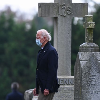 US President-elect Joe Biden walks past tombstones after leaving the St Joseph on the Brandywine Catholic Church after attending Mass in Wilmington, Delaware, on Sunday. Photo: AFP