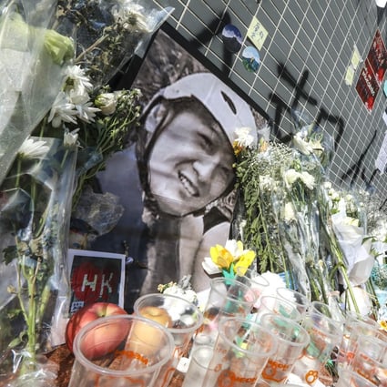 Flowers were laid at the Sheung Tak Estate car park, where student Alex Chow was found with serious injuries before his death a few days later. Photo: Felix Wong