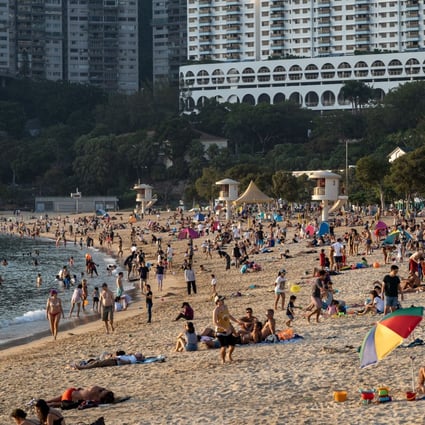 People enjoy time at Repulse Bay beach on November 7. Decisions on whether to go out during the pandemic can seem straightforward, but there are complex forces shaping the world that might be difficult to see at first glance. Photo: DPA