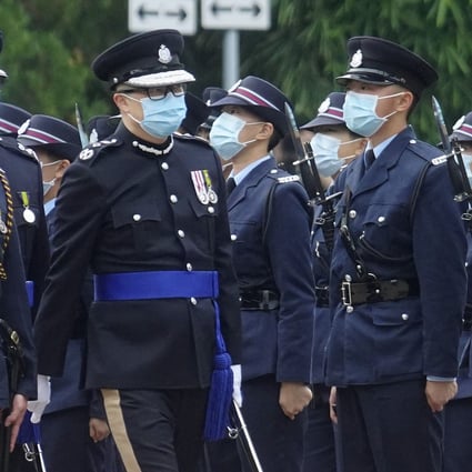 Commissioner of Police Chris Tang inspects officers at Saturday’s passing-out parade. Photo: Winson Wong