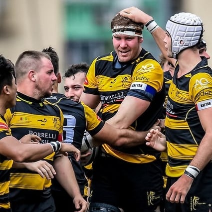 Tigers teammates congratulate substitute Craig Lodge after scoring the game-winning try at King’s Park. Photo: Ike Images