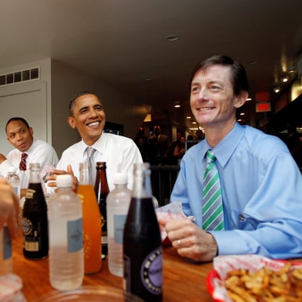 Then-Chief of Staff of the Vice President Bruce Reed (right) with then-US President Barack Obama (centre) at the Good Stuff Eatery on Capitol Hill in Washington, August 3, 2011. Reed is now tech adviser to President-elect Joe Biden. Photo: Reuters
