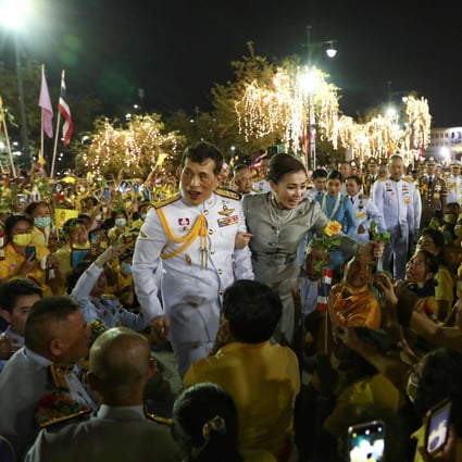 Thai King Maha Vajiralongkorn and Queen Suthida greet supporters outside the Grand Palace in Bangkok after presiding over a religious ceremony at a Buddhist temple inside the palace earlier this month. Photo: AFP
