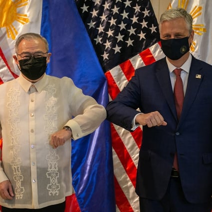 Philippines’ foreign minister Teodoro Locsin bumps elbows with US National Security Adviser Robert O'Brien on Monday. Photo: EPA-EFE