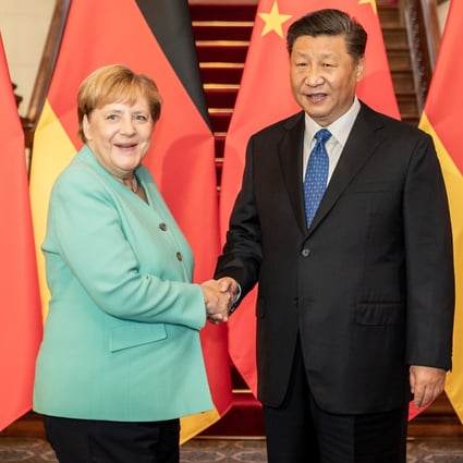 German Chancellor Angela Merkel and Chinese President Xi Jinping during talks in Beijing last year. Xi told Merkel by phone on Tuesday that Chinese economic development would benefit Germany. Photo: dpa