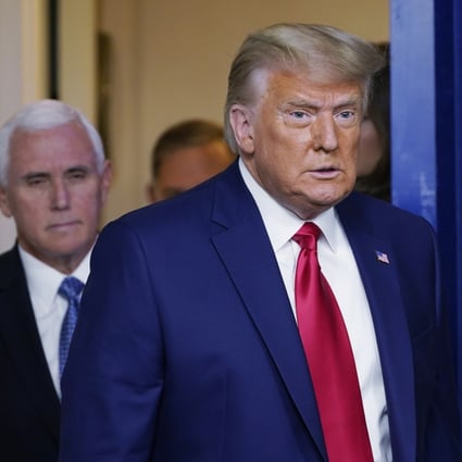 President Donald Trump, followed by Vice-President Mike Pence, walks into the briefing room at the White House on November 24, 2020, to make a statement. Photo: AP