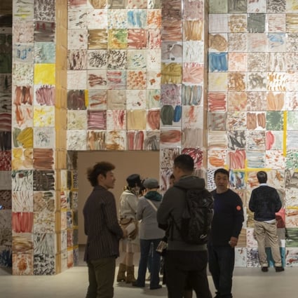 “A Room that can Move” at Shanghai Power Station of Art museum features an installation by Zhang Enli composed of over 1,000 painted paper boxes. The exhibition spans the Chinese artist’s journey from dark-hued figurative art to abstract painting. Photo: Shanghai Power Station of Art Museum